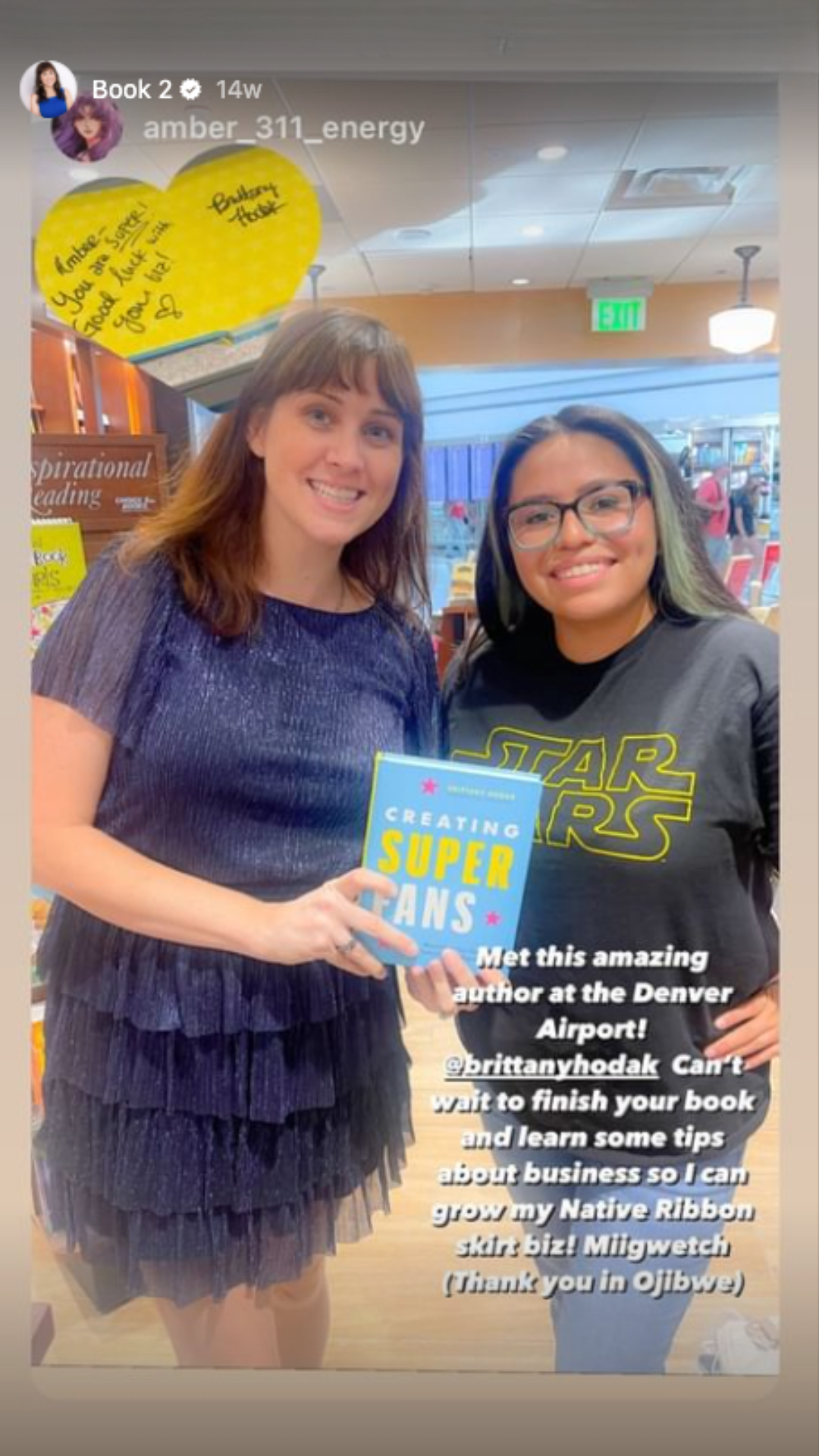 Brittany Hodak with reader in Denver airport